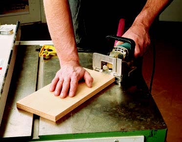 Cutting biscuit slots to assemble sanding cart top
