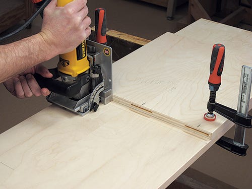 Using a biscuit joiner to cut joinery for bedframe