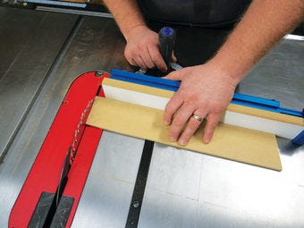 Using miter gauge and fence to cut miters on table saw