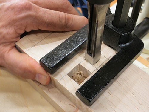 Cutting through mortise holes with mortising machine