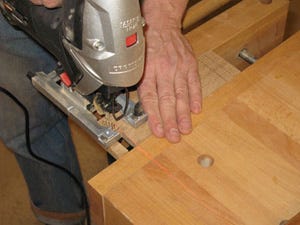 Using jigsaw to cut waste away from napkin holder rail