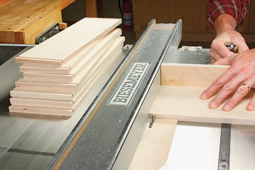 Cutting dadoes in side panels of outfeed table drawers