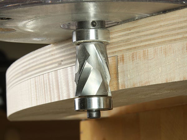 Cutting edge on shelving with spiral cutting router bit
