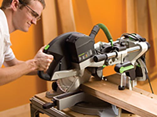 Making cuts across lumber with a sliding miter saw