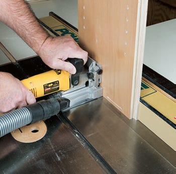 Cutting biscuit slots in base of kitchen cabinet carcass