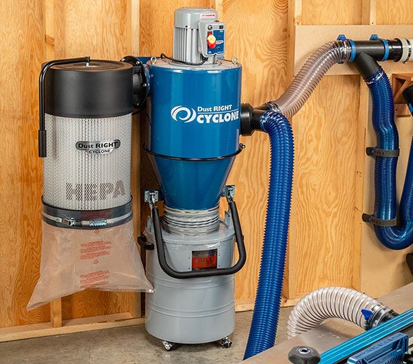 cyclone dust collector mounted on workshop wall