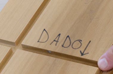 Freshly cut dado in wood panel