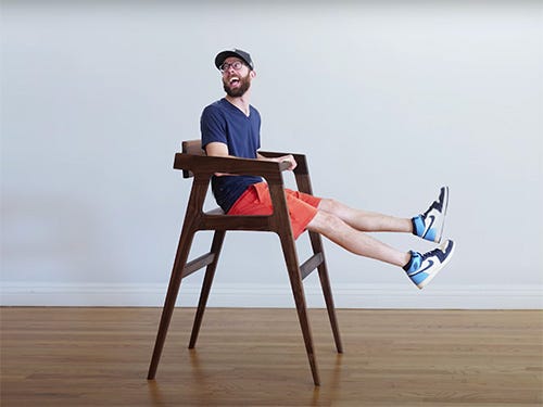 Chris Salomone sitting in shop-built high chair