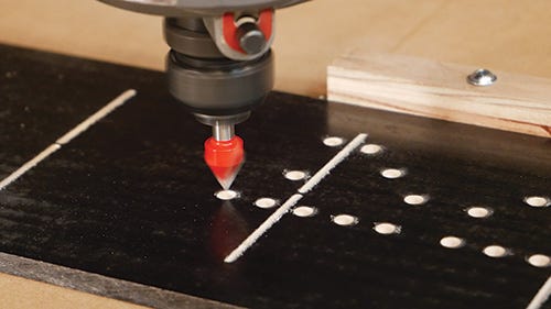 Using CNC drill bit to cut out domino holes