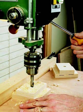 Drilling holes with drill press for installing pivot bolts