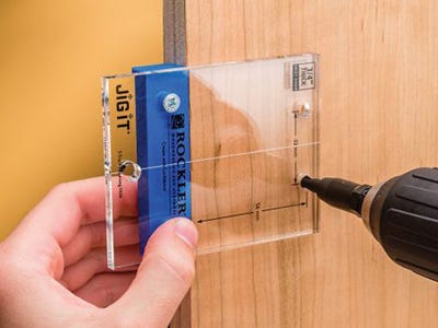 Jig-it drill guide marking hinge installation on frameless door
