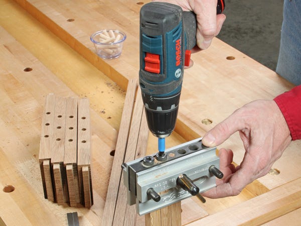 Cutting dowel holes with a clamp-on doweling jig