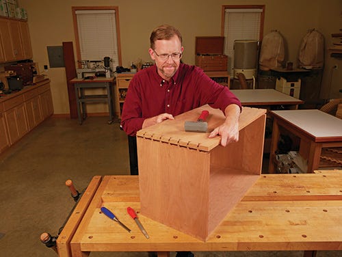 Testing the fit of the dovetail pins and sockets before glue-up and clamping