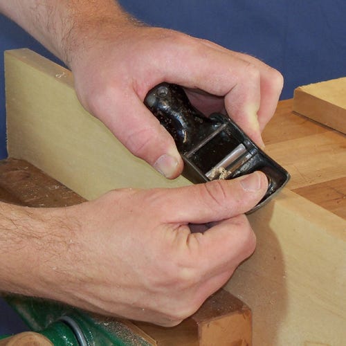 Smoothing board edges with block plane