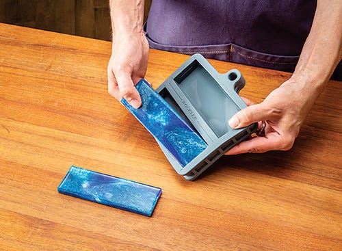 Removing poured knife handle blocks from mold