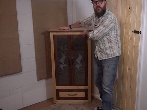 David Picciuto and his etched glass corner storage cabinet