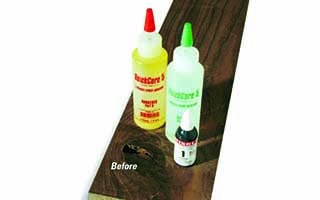 wood filler product options sitting on plank of wood