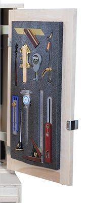 Small hand tools stored in foam panel