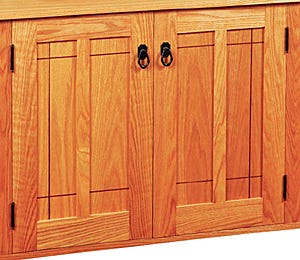 Cabinet door with frame and panel construction and slight reveal for wood expansion