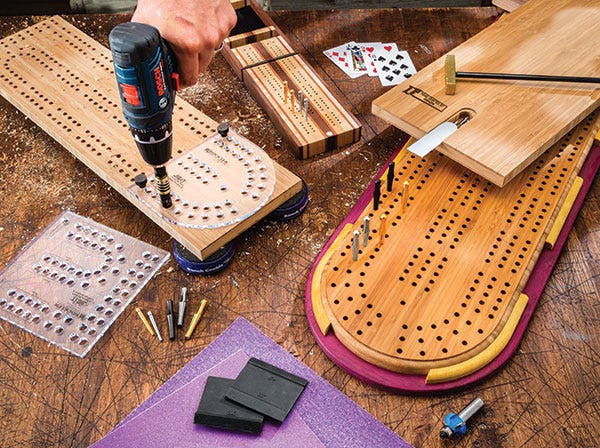 cribbage boards being built on a workbench