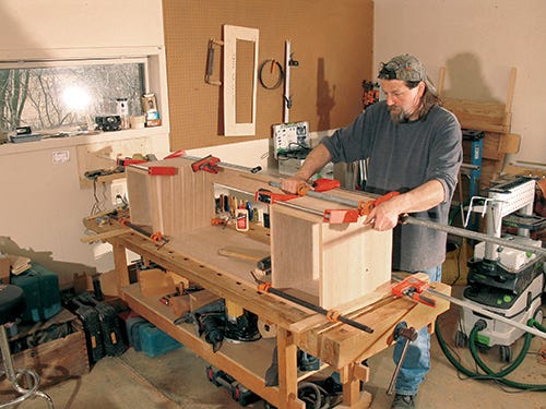 Gluing and clamping base joinery of media center cabinet