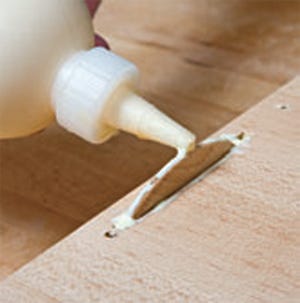 Applying glue in biscuit joinery slot