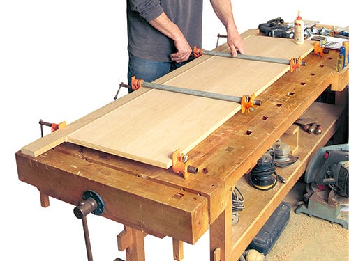 Using a caul to clamp and glue media center carcass together