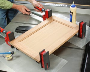 Gluing and clamping a panel frame