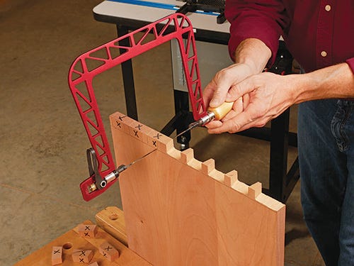 Rough cutting dovetail pins with coping saw 