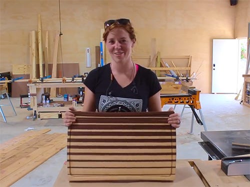 April Wilkerson showing edge grain incremental cutting board