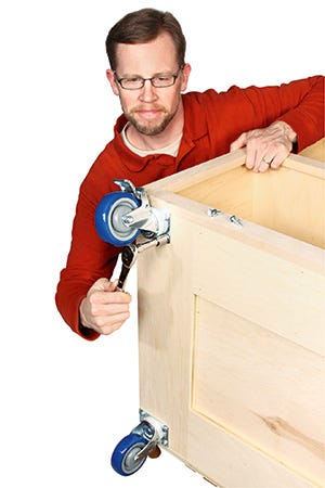 Securing heavy duty casters to base of miter saw cabinet