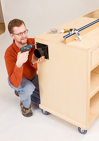 Attaching dust port to miter saw station dust chamber