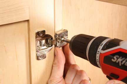 Drilling screws into european-style hinge installation