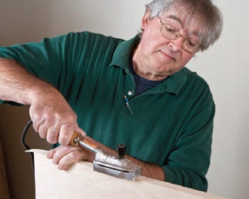 Using iron to activate glue on edge banding