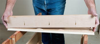 Attaching cleat to top panel of cabinet carcass