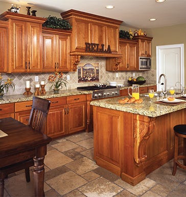 Upper and lower kitchen cabinets with an island