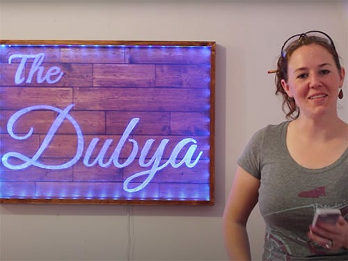 April Wilkerson and her bar sign with led backlights