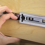 Tab in drawer slide for removing drawer without a tool