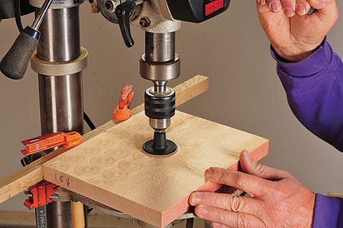 Using a sanding disc and drill press to lightly create patterns in wood