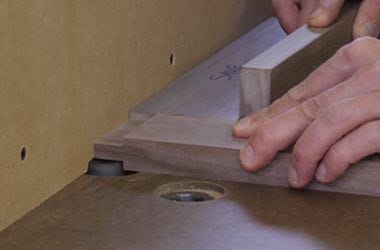 Cutting a tenon with a router mounted in a router table