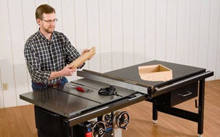 man cutting rabbet joints on a tablesaw