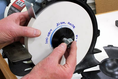 Writing grit and material information on the side of a grinding wheel