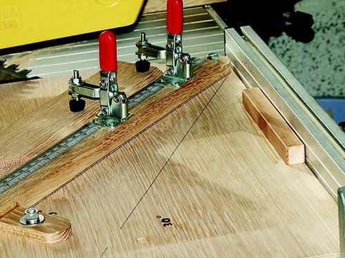 Marking positioning for swivel arm for various angle cuts on miter cutting sled