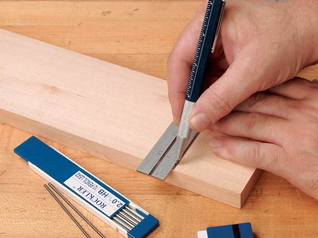 Using mechanical cabinet maker's pencil to mark cut lines on a board