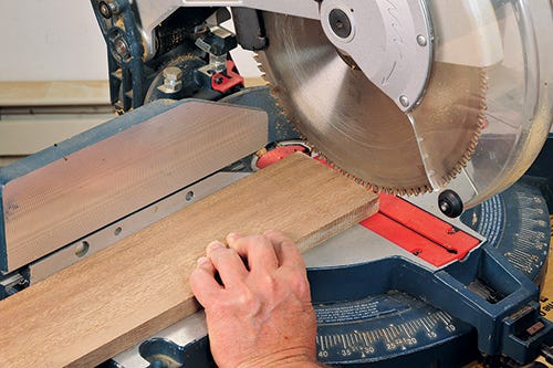 Marking a cut on a workpiece with a crosscut saw