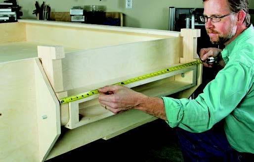 Measuring out the length of the panel storage bracket