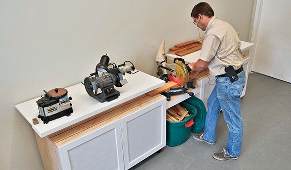 Space saving miter saw workbench