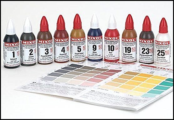 Mixol dye bottles and color matching charts