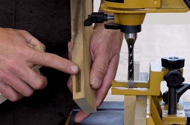 Demonstrating how to cut mortises with a hollow chisel
