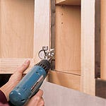 Mounting European cup hinge to cabinet casework